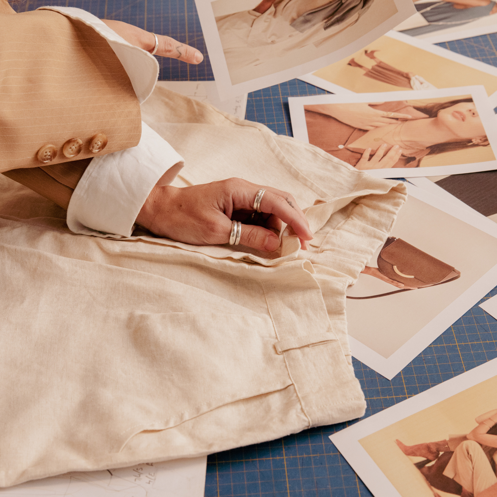 A woman choosing fabrics for her fashion brand